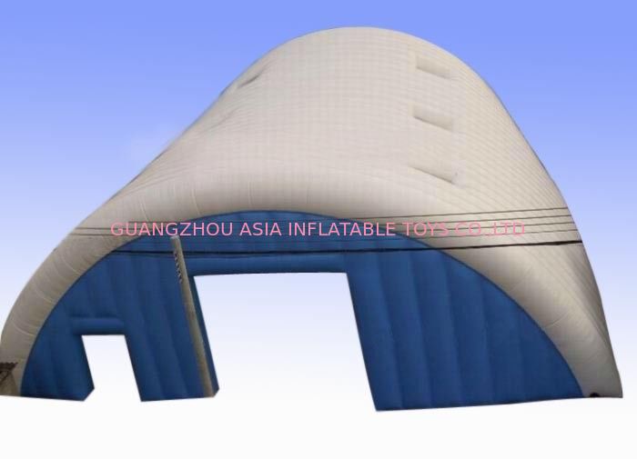 Large white and blue inflatable event tent with clear sky windows